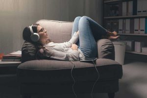 Teenager relaxing with music