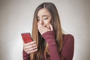Teenager crying over friendship on phone