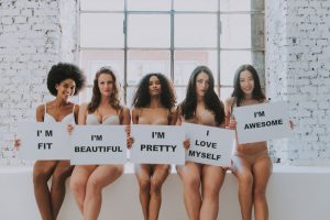 Group of ladies of different shapes and sizes who are happy with their body image