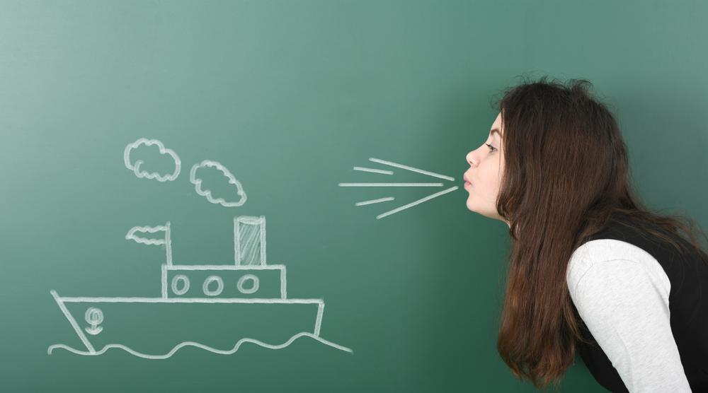 Pre-adolescent,Girl,Blowing,On,Painted,Sailing,Ship.,Portrait,Photo,On stay on course