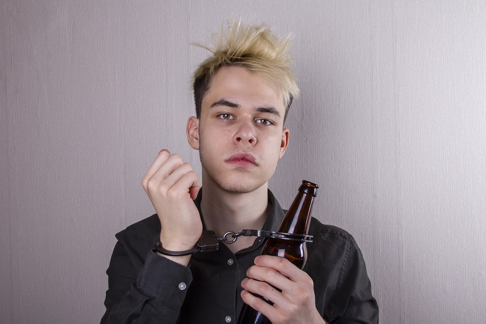 A,Teenager,Is,Handcuffed,To,A,Beer,Bottle,On,A